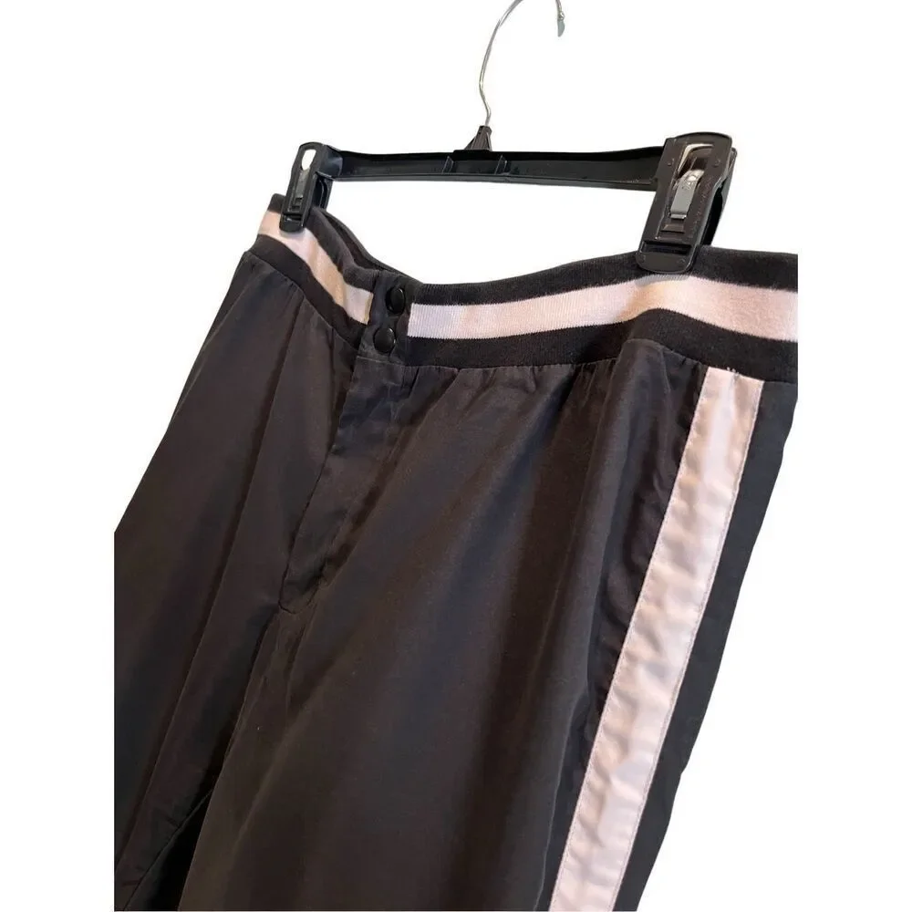 Nike black track pants with white side stripes and ankle zippers - L